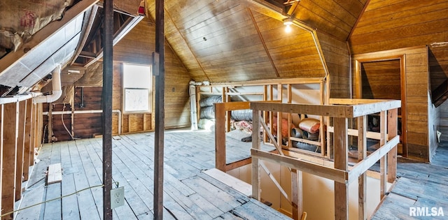 unfinished attic with an upstairs landing