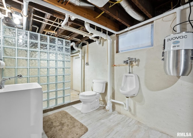 bathroom with wood finished floors, walk in shower, and toilet