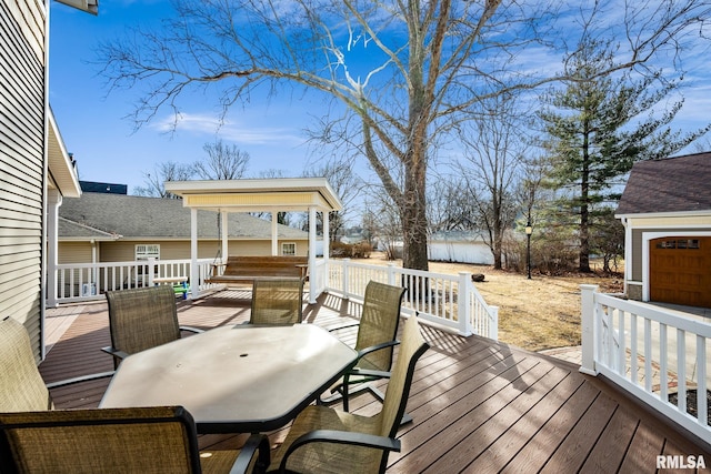 wooden deck featuring outdoor dining space