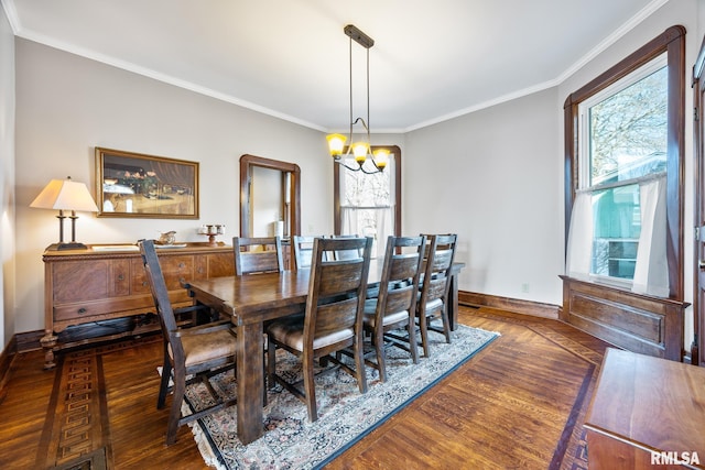 dining room with plenty of natural light, a notable chandelier, and wood finished floors