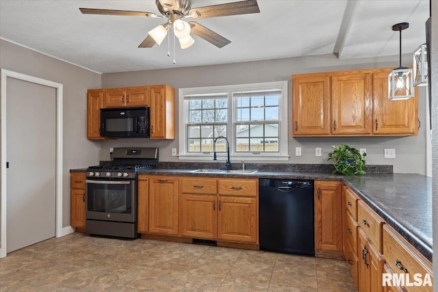 kitchen featuring visible vents, ceiling fan, a sink, black appliances, and dark countertops