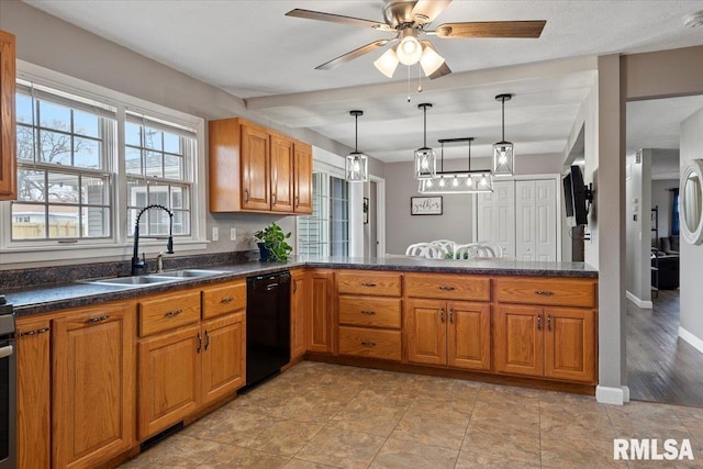 kitchen with dishwasher, ceiling fan, brown cabinets, and a sink