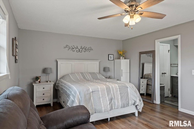 bedroom with ceiling fan, baseboards, and wood finished floors