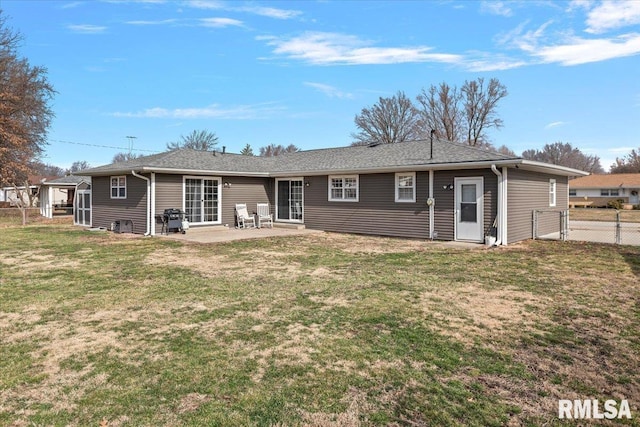 back of house featuring a patio area, a gate, a yard, and fence