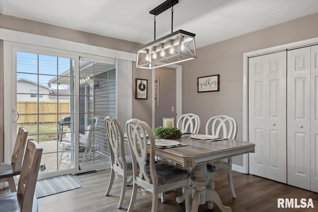 dining space featuring wood finished floors