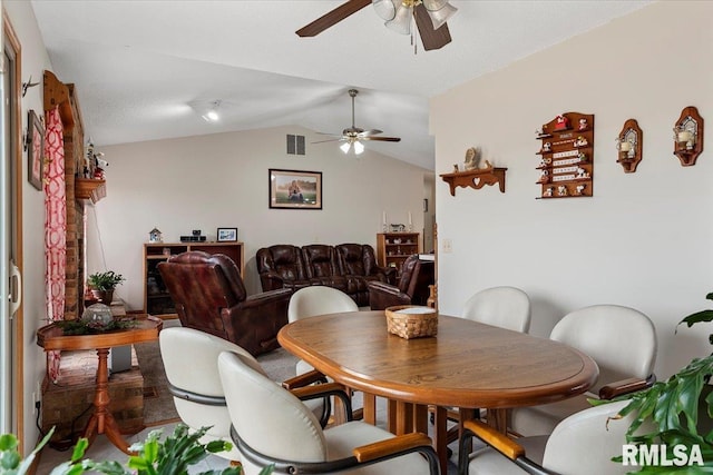 dining area with ceiling fan, visible vents, and vaulted ceiling