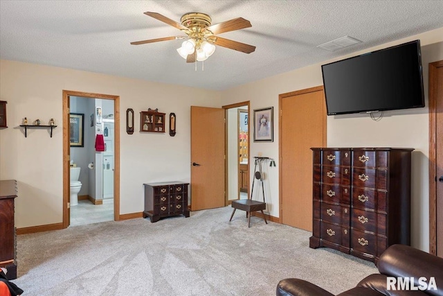 sitting room featuring carpet, baseboards, ceiling fan, and a textured ceiling