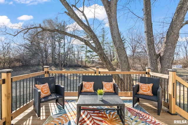 wooden terrace with outdoor lounge area