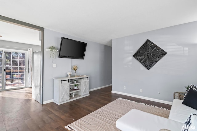 interior space with baseboards and dark wood-type flooring