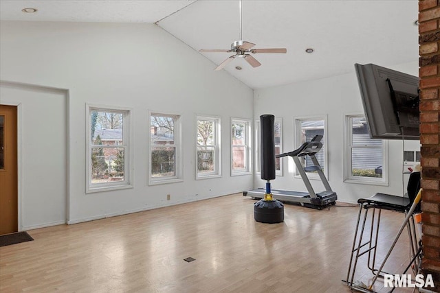 exercise area with ceiling fan, high vaulted ceiling, wood finished floors, and baseboards