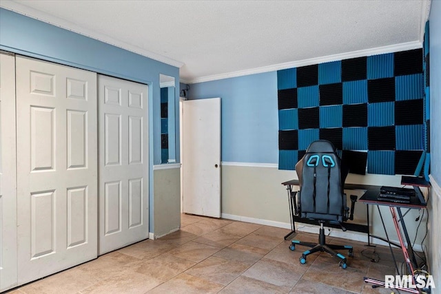 office space with a textured ceiling, ornamental molding, and baseboards