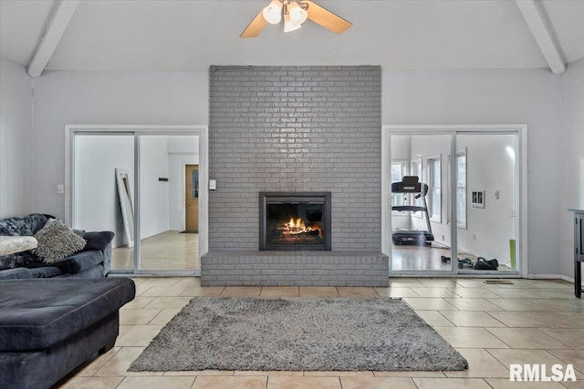 tiled living area featuring a ceiling fan, beam ceiling, and a fireplace