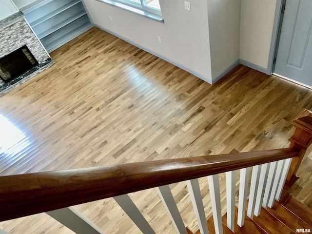 interior details with baseboards and wood finished floors