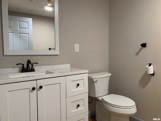 half bath with toilet and vanity