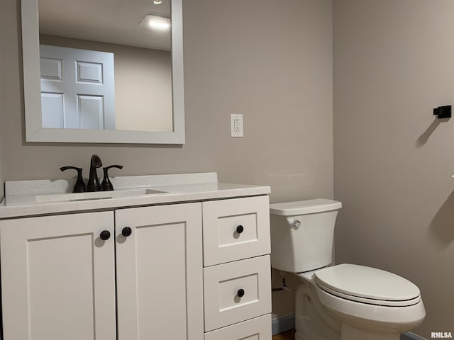 half bath with toilet and vanity