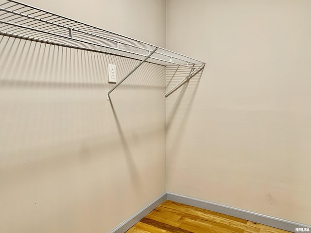 spacious closet featuring light wood-style floors