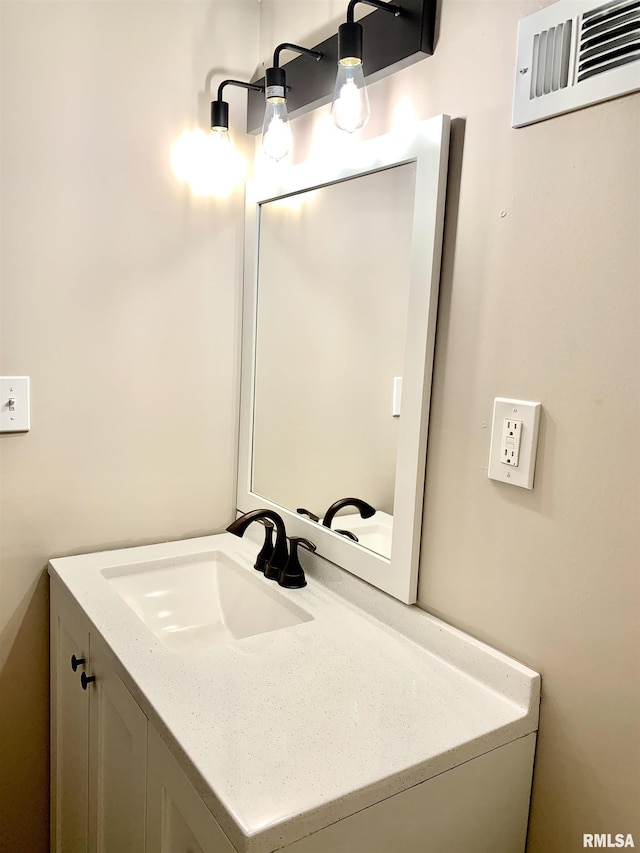 bathroom featuring visible vents and vanity