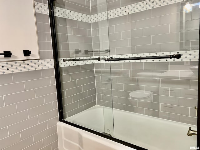 full bathroom with shower / bath combination with glass door