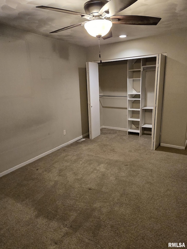 unfurnished bedroom featuring carpet, ceiling fan, and baseboards