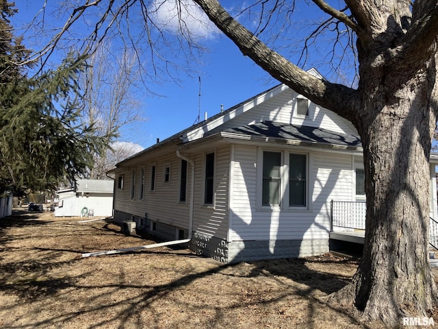 view of property exterior with central AC unit