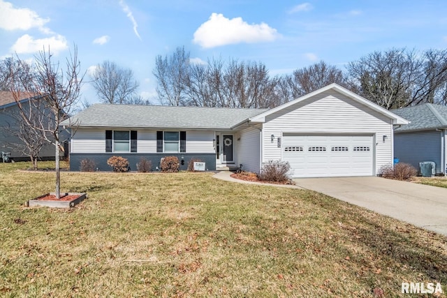 ranch-style home featuring concrete driveway, an attached garage, a front yard, and a shingled roof