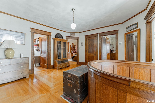 interior space with ornamental molding and baseboards