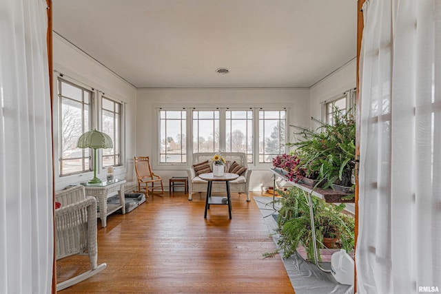 sunroom featuring a healthy amount of sunlight and visible vents