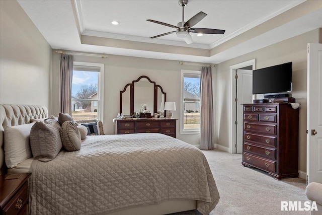 bedroom with baseboards, a raised ceiling, crown molding, and light colored carpet