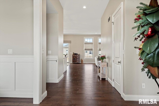 foyer with visible vents, a wainscoted wall, dark wood-type flooring, a decorative wall, and recessed lighting