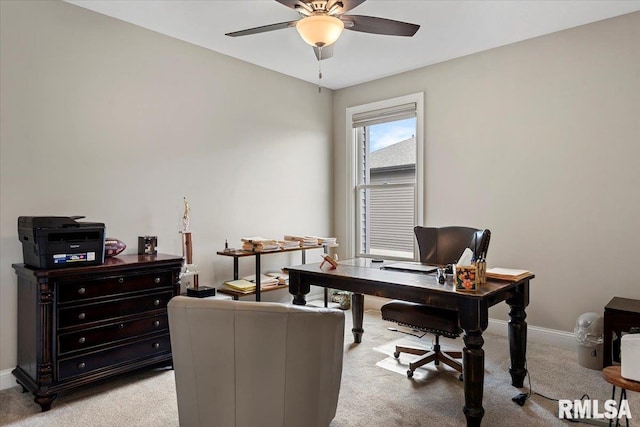 home office with light carpet, ceiling fan, and baseboards