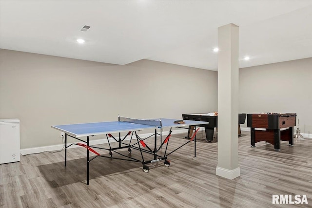 rec room with recessed lighting, light wood-type flooring, visible vents, and baseboards