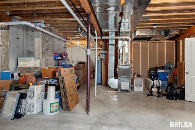 unfinished basement with water heater and heating unit