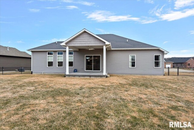 back of house with a yard, a patio, fence, and a ceiling fan