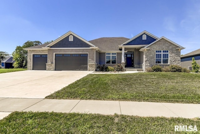 craftsman-style home with a garage, concrete driveway, a front lawn, and stone siding