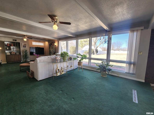 living room with a textured ceiling, carpet floors, visible vents, baseboards, and beamed ceiling