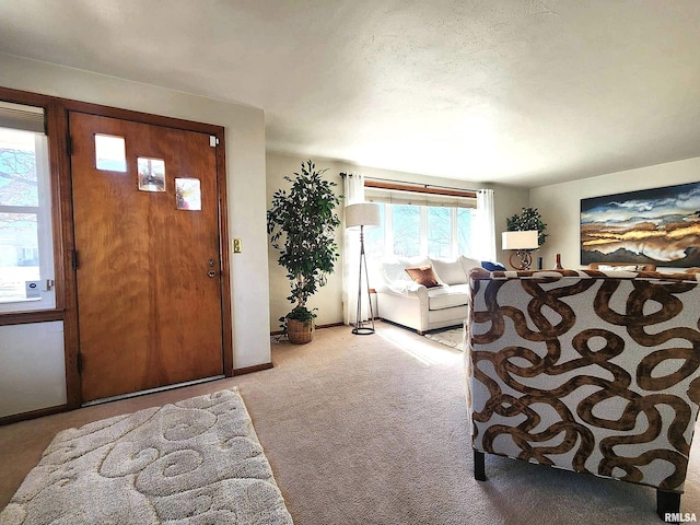 entrance foyer with light colored carpet