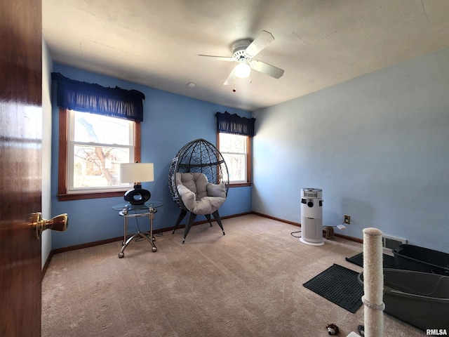 interior space with ceiling fan and baseboards