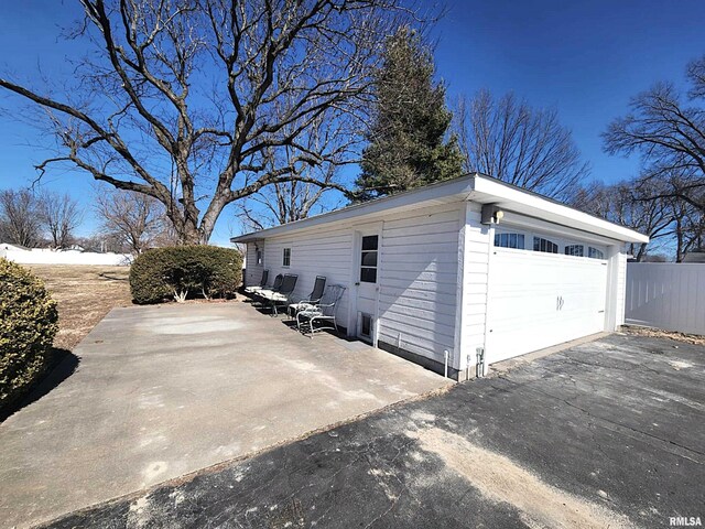 detached garage with fence