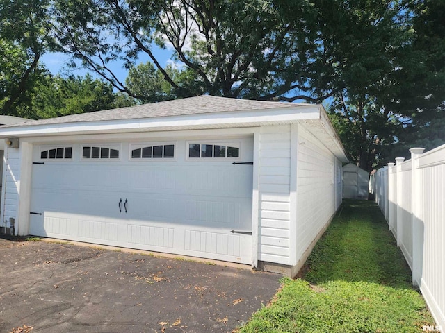 detached garage with fence