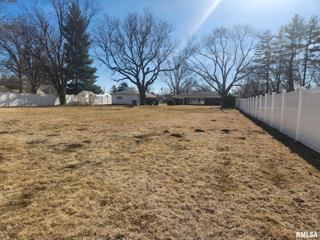 view of yard with a fenced backyard