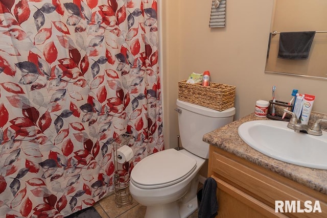 full bath with vanity, toilet, and tile patterned floors