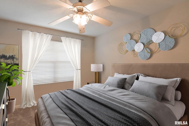 carpeted bedroom with ceiling fan