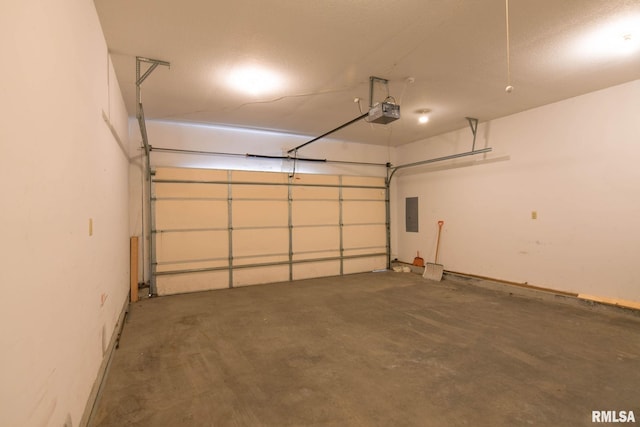 garage featuring electric panel and a garage door opener