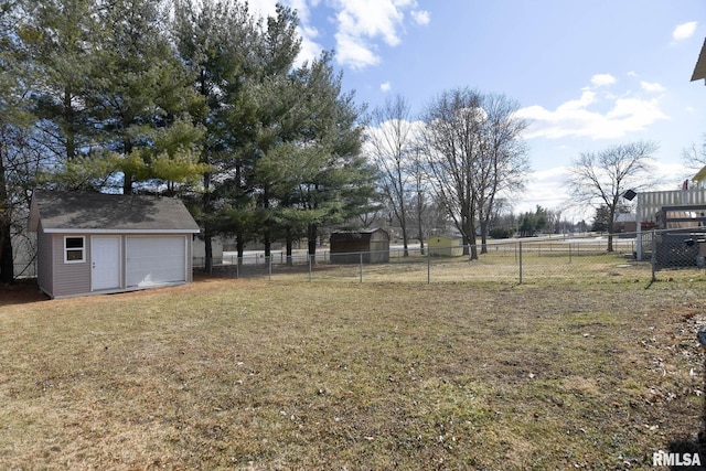 view of yard featuring an outbuilding, a shed, and fence