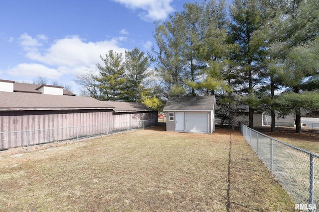 view of yard with an outbuilding, a fenced backyard, and a storage shed