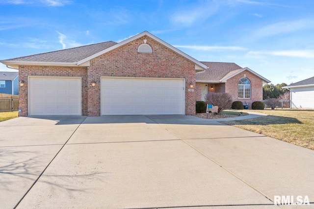 ranch-style home featuring a garage, brick siding, fence, concrete driveway, and a front lawn