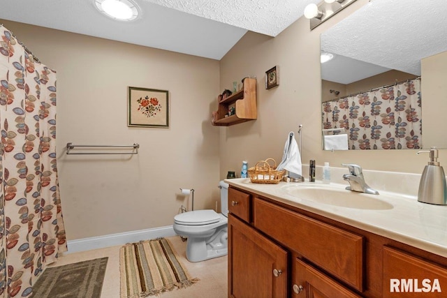 bathroom featuring toilet, a textured ceiling, vanity, baseboards, and tile patterned floors