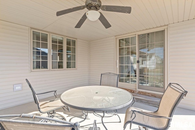 view of patio / terrace with a ceiling fan and outdoor dining space