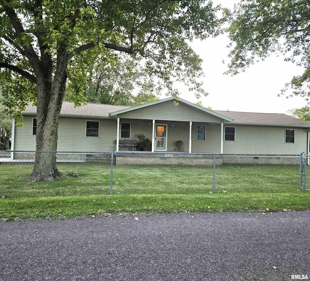 view of front of house with a fenced front yard, crawl space, and a front lawn