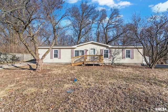 manufactured / mobile home featuring fence and a deck